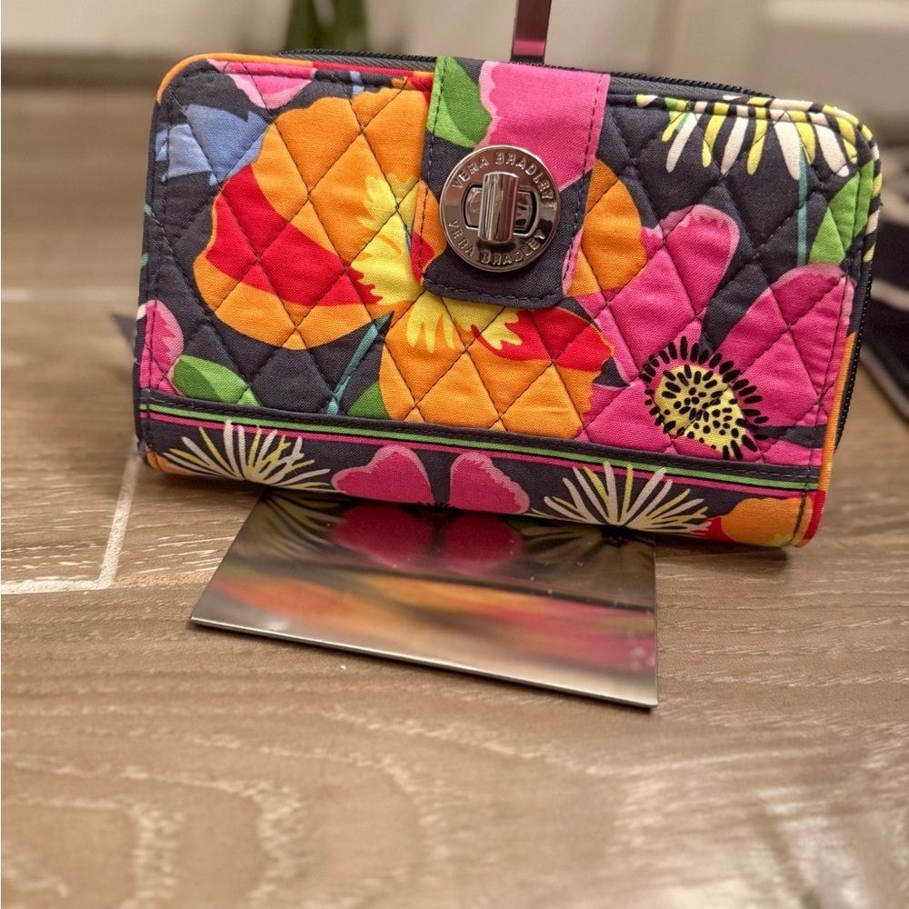 Turn Lock & Zip Organizer Wallet in the "Jazzy Blooms" pattern.